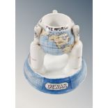 A Dewar porcelain ashtray modelled as the globe,