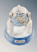 A Dewar porcelain ashtray modelled as the globe,