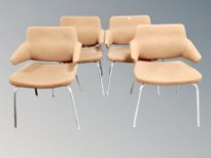 A set of four 20th century Danish armchairs in cinnamon upholstery
