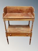 A mahogany two tier side table fitted a drawer,