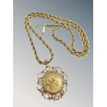 A George V full sovereign 1912 in 9ct gold mount, upon a gold-plated rope-twist chain.