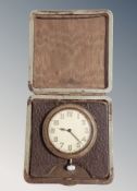 A travel clock in fitted case