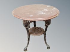 A circular topped cast iron Britannia bar table,