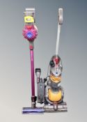 A Dyson DC24 ball vacuum cleaner together with a further dyson V7 stick vacuum.
