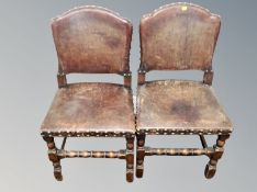 A pair of 19th century brown studded leather dining chairs