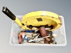 A box containing a small quantity of hand tools, steering wheel lock.