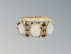 A 9ct gold opal and garnet ring, size Q CONDITION REPORT: 4.2g. One opal chipped.