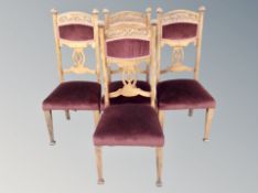 A set of four Edwardian carved beech chairs in purple upholstery