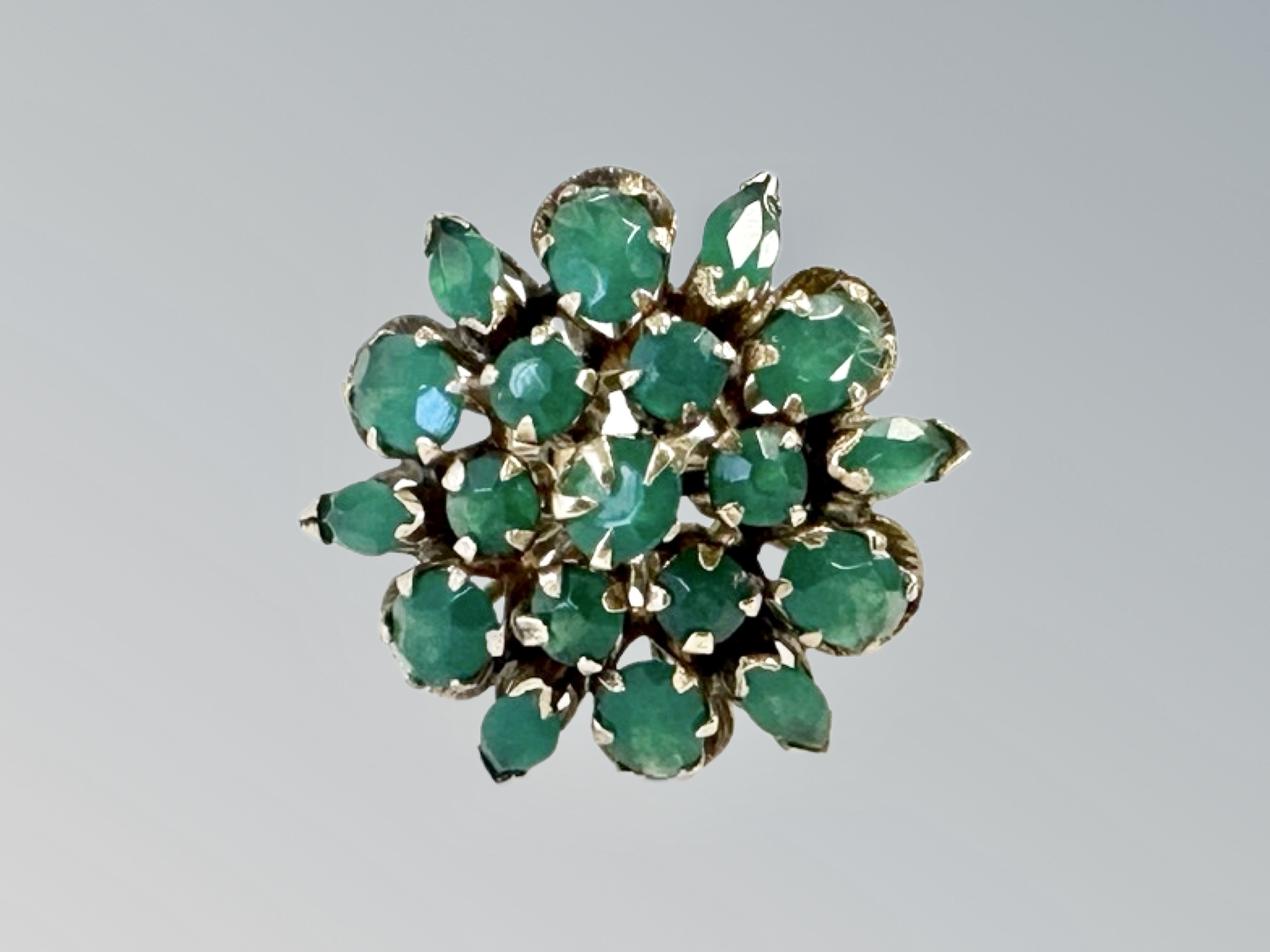 A gold emerald cluster ring, stamped 14ct, size L. CONDITION REPORT: 6.