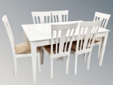 A Scandinavian white dining table and set of six chairs