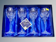 A boxed set of four Bohemia crystal wine glasses.