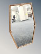 An Edwardian oak framed bevelled mirror