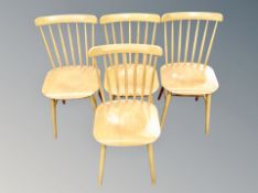 A set of four Danish spindle back dining chairs