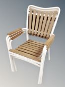 A set of three metal framed wooden slatted stacking garden armchairs