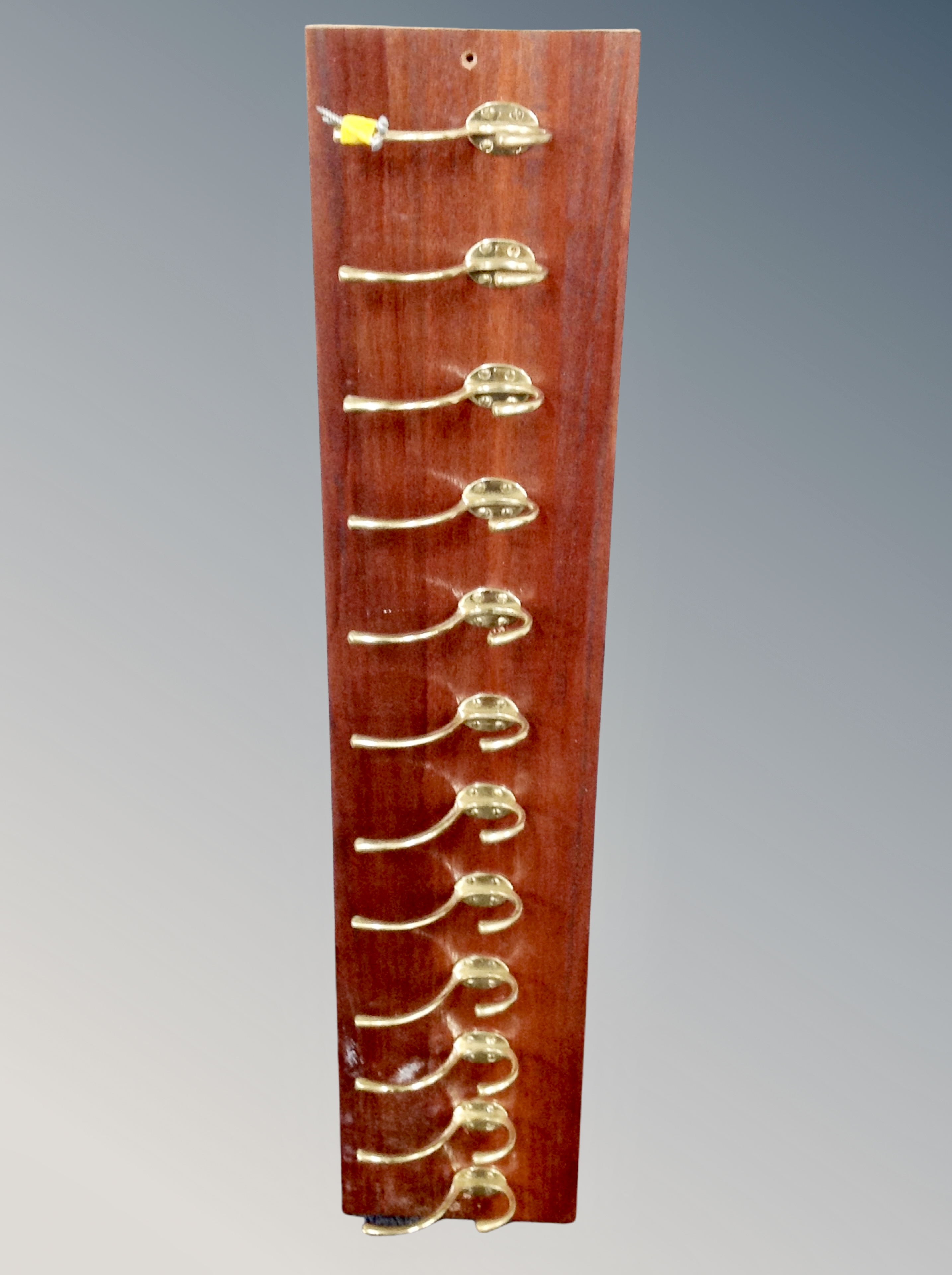 A twelve-hook coat rack, length 93 cm.