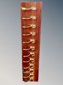 A twelve-hook coat rack, length 93 cm.