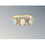 An 18ct gold peal and diamond ring, size P CONDITION REPORT: 3.