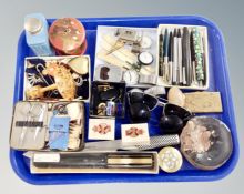 A tray containing sunglasses, costume jewelry, wrist and fob watches, ballpoint pens etc.