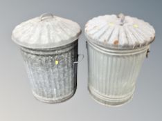 Two galvanised bins with lids