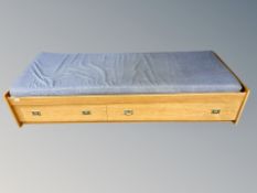 A Scandinavian oak day bed fitted with drawers,