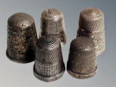 Five silver thimbles