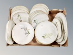 A box of Royal Copenhagen porcelain dinner plates.