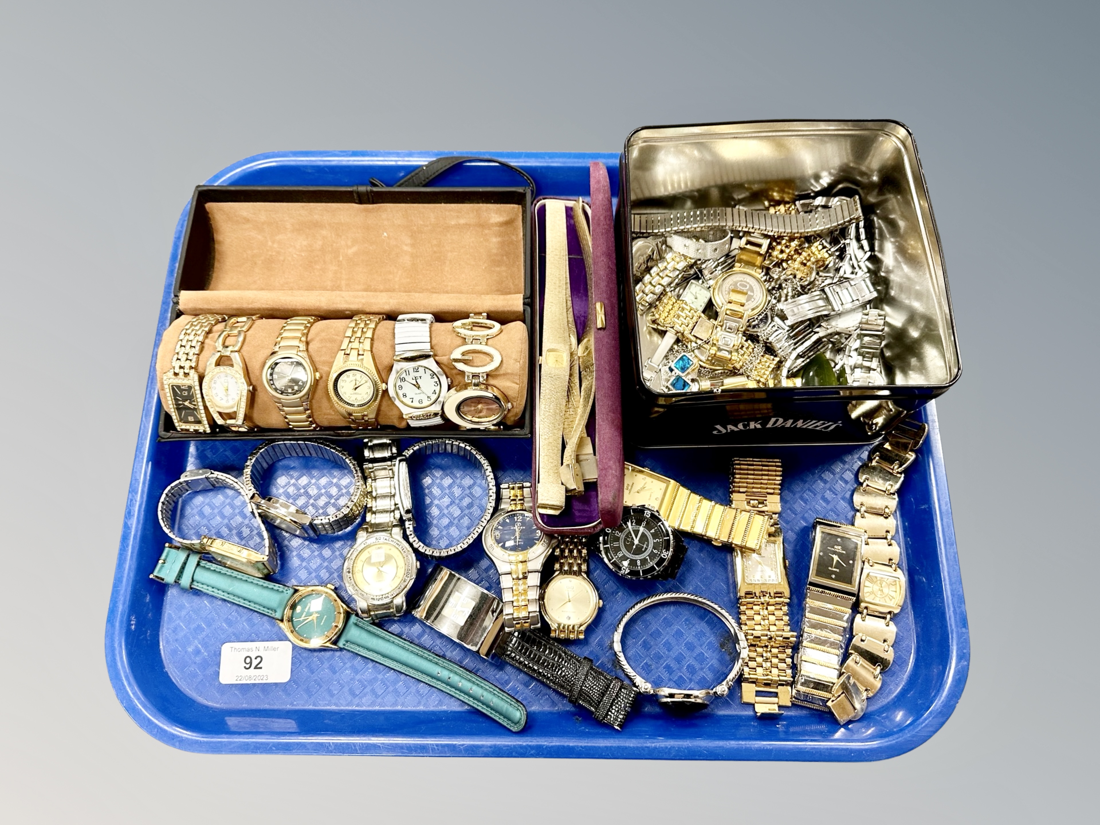 A tray of lady's and gent's fashion wristwatches