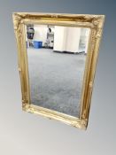 A Victorian style gilt framed beveled mirror 90 cm x 64 cm.