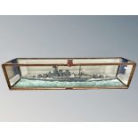 A hand built scale model of the British WWII battleship HMS Hood, in glazed display case,