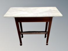 An Arts and Crafts marble top side table