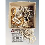 A box of costume jewellery, faux pearls, beaded necklaces,