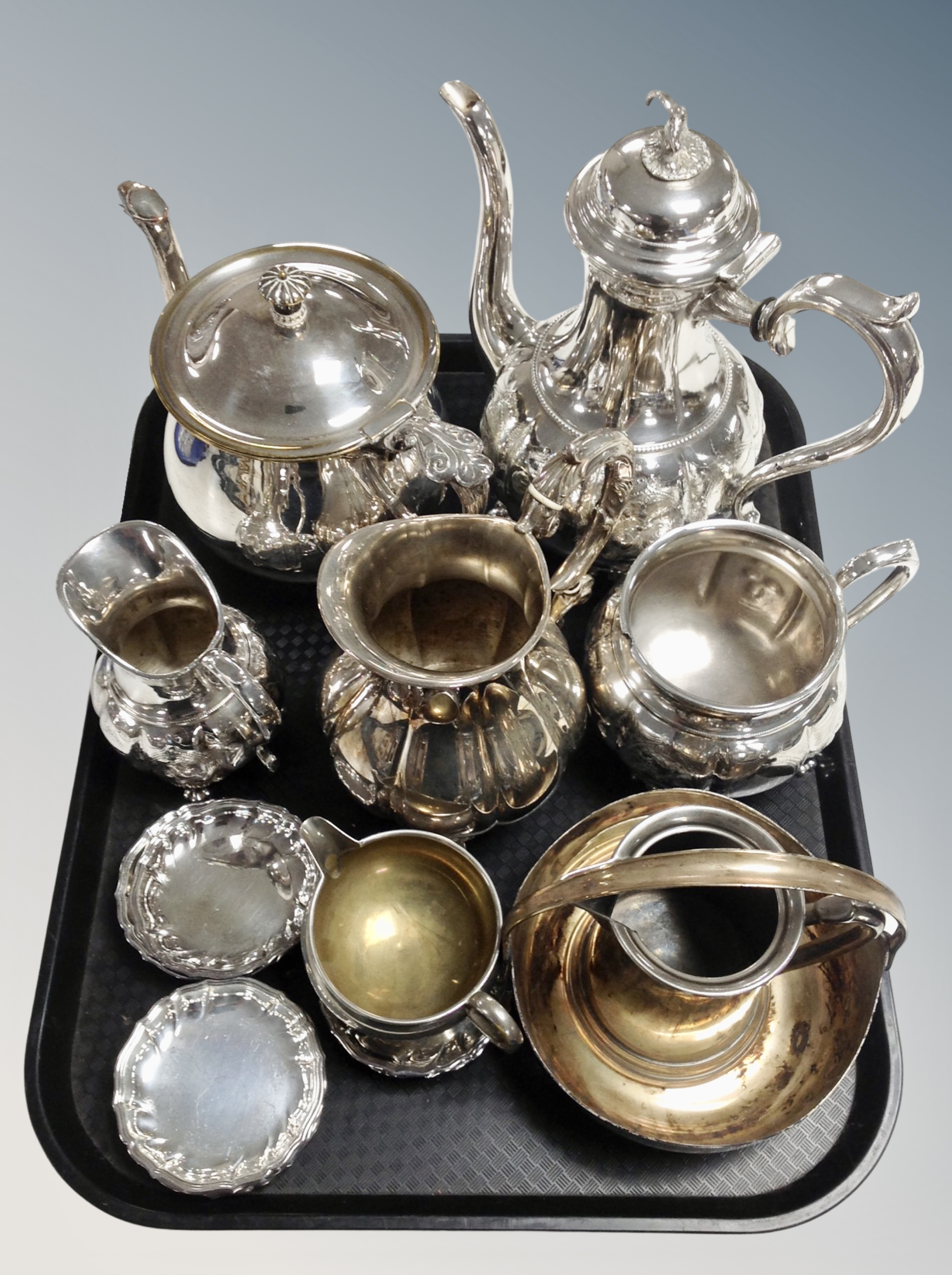 A tray of silver plated wares including tea set, pin dishes etc.