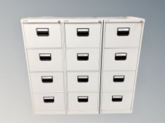Three Arkifili metal four drawer filing cabinets