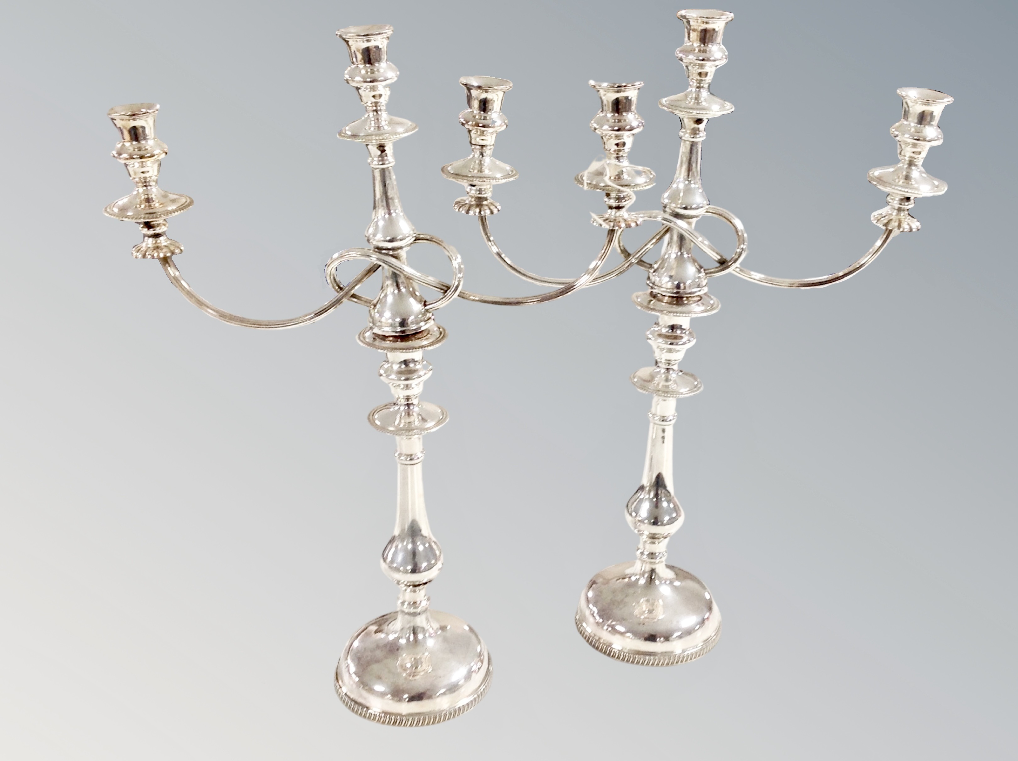 A pair of silver plated three sconce candelabra, height 49 cm.