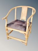 A wicker conservatory armchair