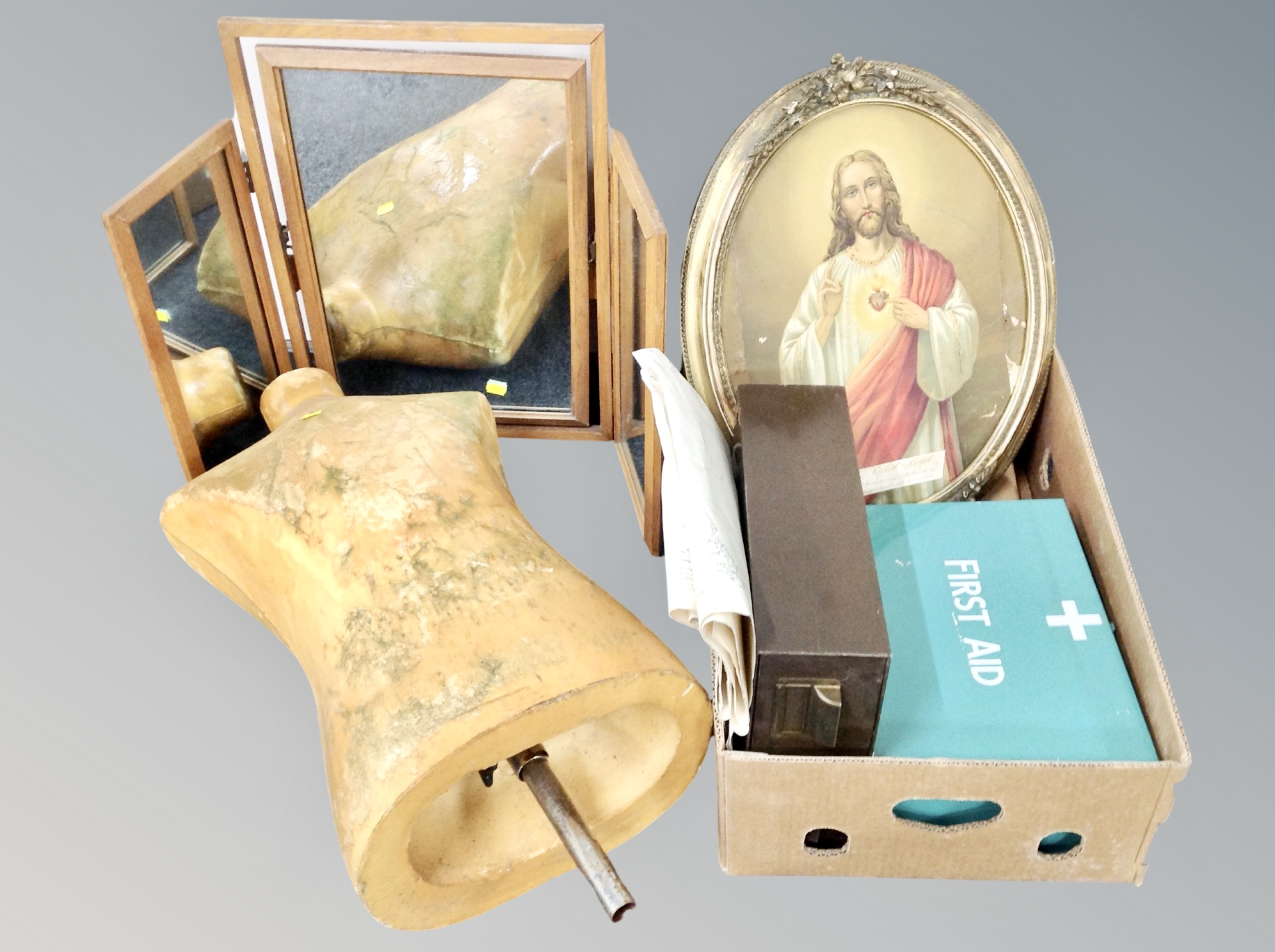A box containing first aid tin, religious print in gilt frame, folding mirror, metal index chest,