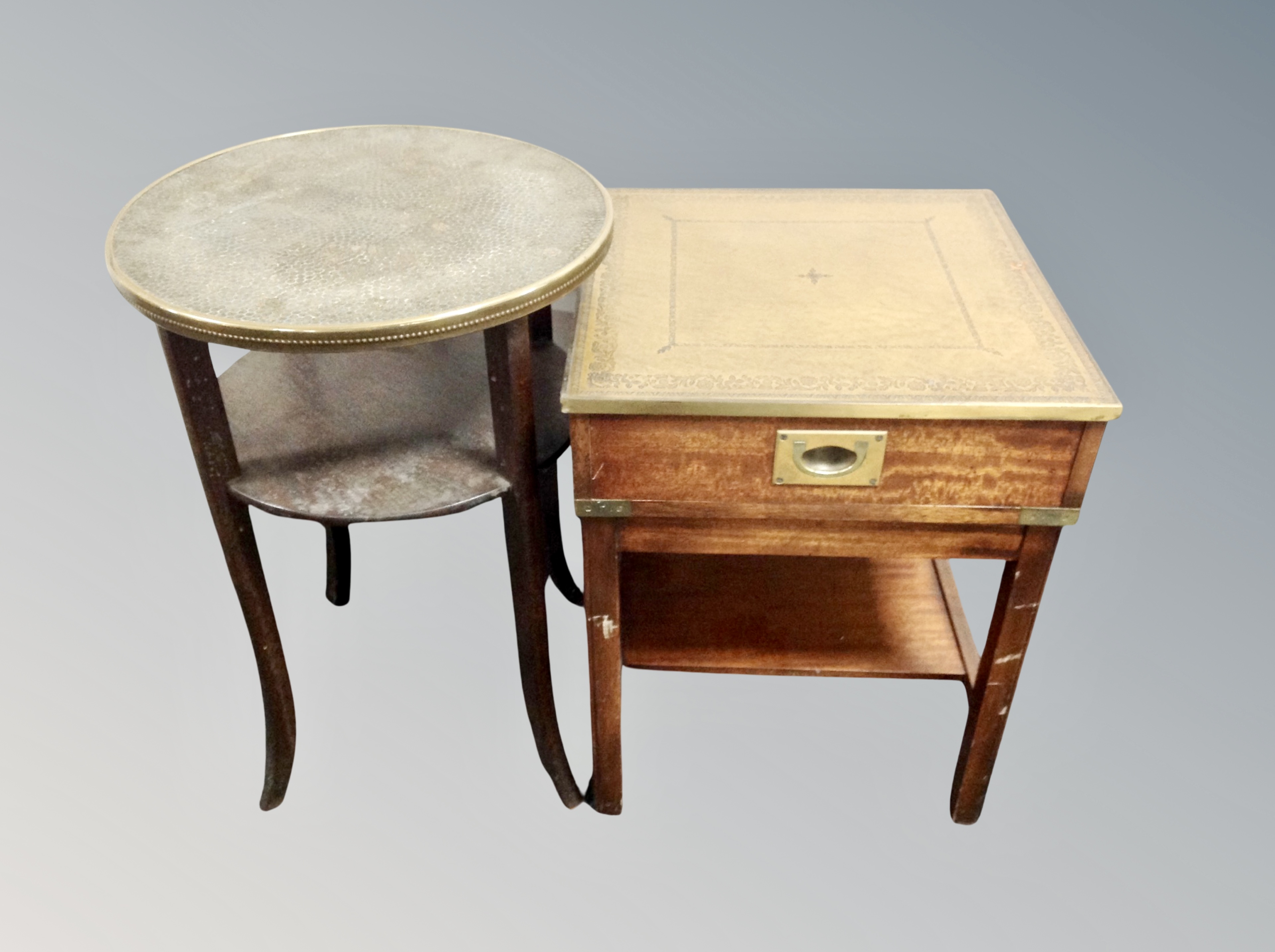 A campaign style lamp table with tooled leather inset panel,
