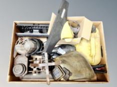 A box containing kitchen scales, drill bit set,