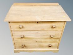 An Edwardian pine three drawer chest,