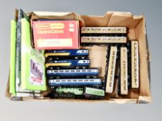 A box containing Hornby rolling stock, Triang power control unit etc.