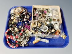 A small tray of two boxes containing costume jewellery