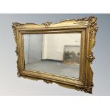 An early 20th century gilt and gesso overmantle miror 133 cm x 100 cm