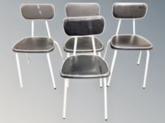 A set of four 1960's black vinyl upholstered chairs on metal legs
