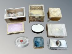 A group of trinket boxes including cast brass examples,