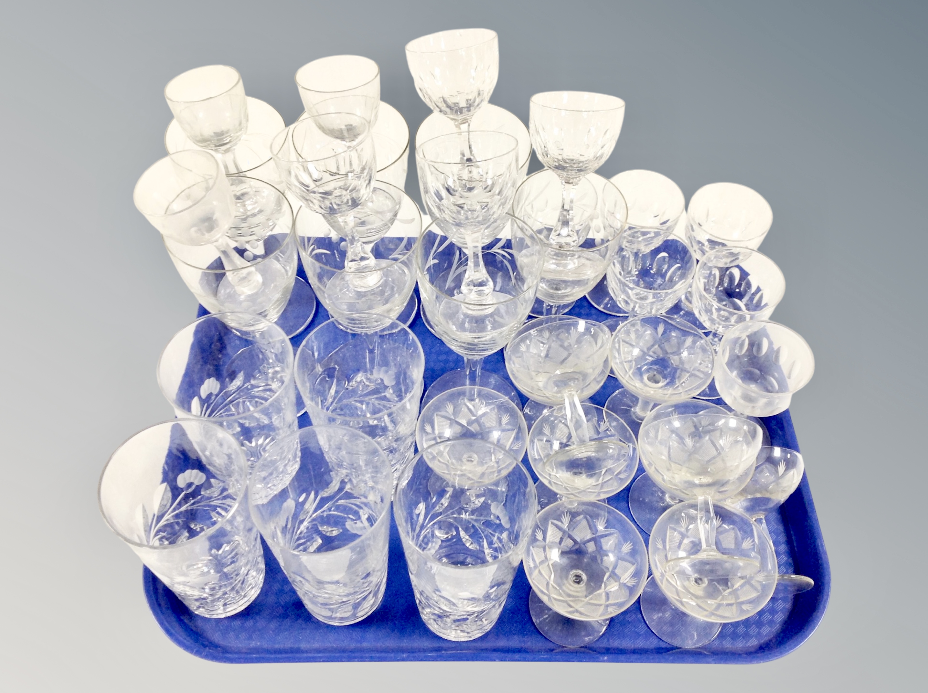 A tray of 20th century etched drinking glasses.