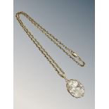 A 9ct gold crystal pendant on similar chain CONDITION REPORT: 13.