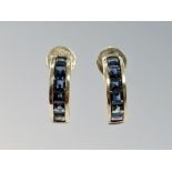 A pair of 14ct gold sapphire half-hoop earrings with post fittings.