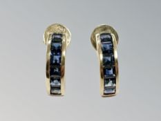 A pair of 14ct gold sapphire half-hoop earrings with post fittings.