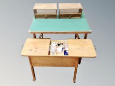 A mid century sewing box with contents together with a pair of wall shelves and a folding baize