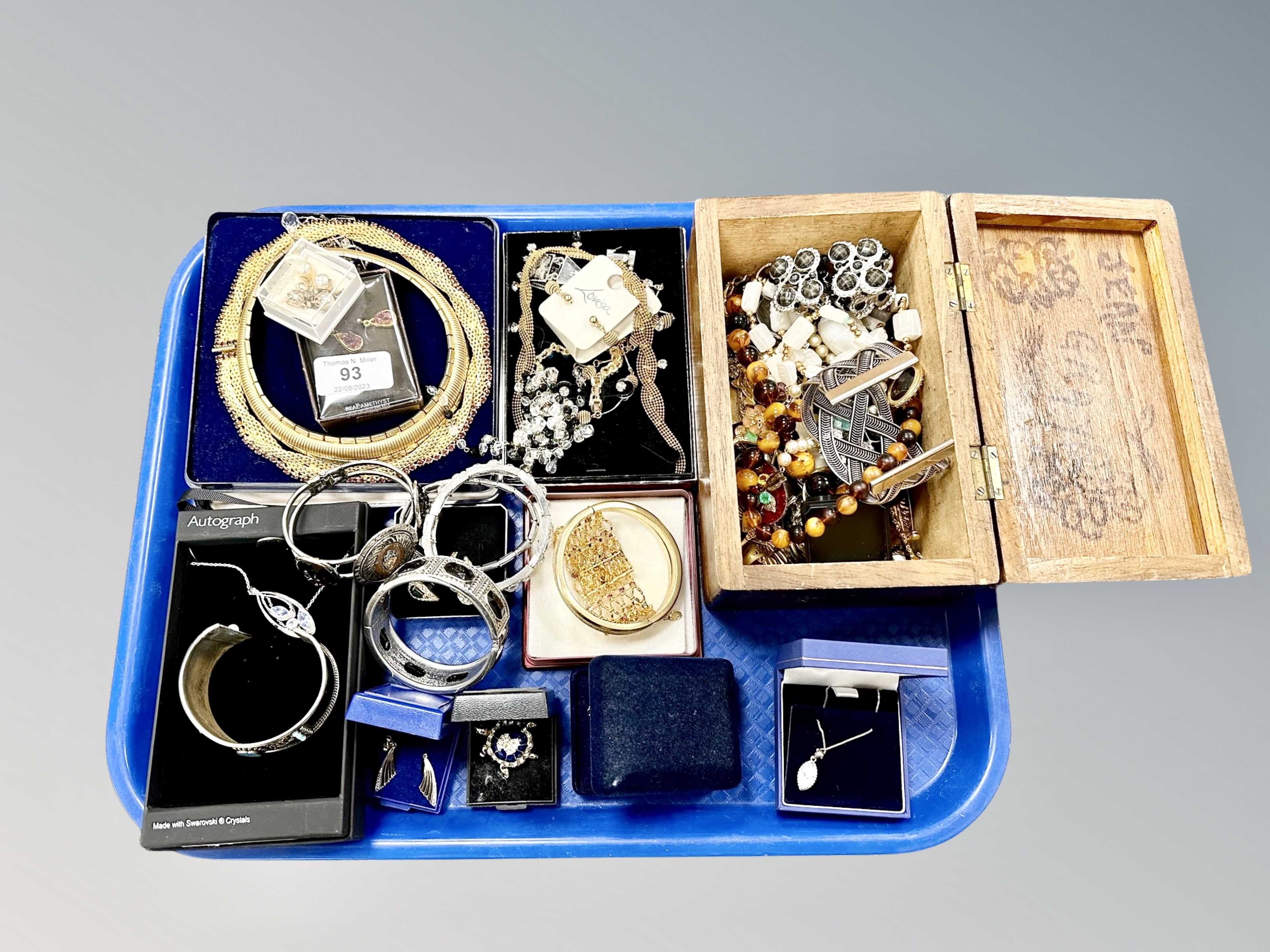 A tray of mostly costume jewellery, pair of 9ct gold earrings, bangles, brooches,